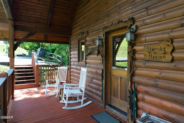 2494 Black Bear Ridge Way, Sevierville, TN 37862 - view of exterior entry with log siding and a wooden deck