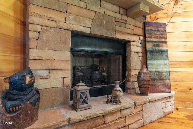 2494 Black Bear Ridge Way, Sevierville, TN 37862 - detailed view of a stone fireplace, wood finished floors, and wood walls