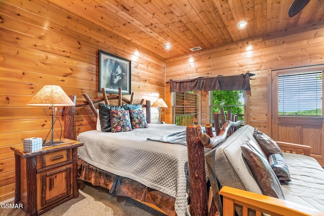 2494 Black Bear Ridge Way, Sevierville, TN 37862 - bedroom with wooden ceiling, wood walls, recessed lighting, and carpet flooring