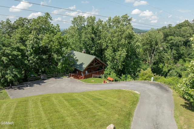 2494 Black Bear Ridge Way, Sevierville, TN 37862 - view of front of house with a wooden deck, asphalt driveway, and a view of trees