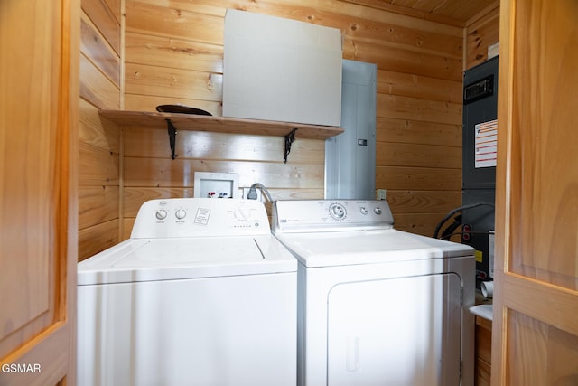2494 Black Bear Ridge Way, Sevierville, TN 37862 - laundry area featuring separate washer and dryer and wood walls