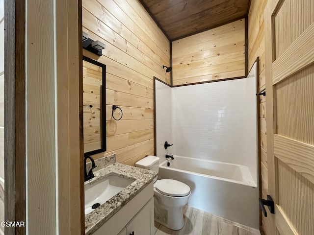 full bathroom featuring vanity, bathing tub / shower combination, wooden walls, toilet, and wood ceiling