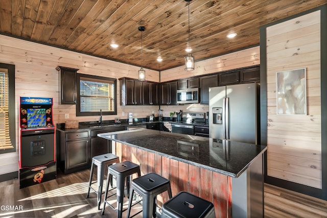 kitchen featuring dark wood-style flooring, stainless steel appliances, wooden ceiling, and a sink