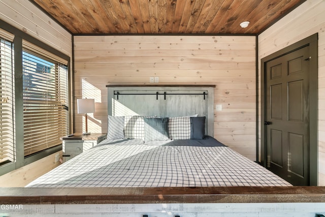 unfurnished bedroom with wood ceiling and wooden walls