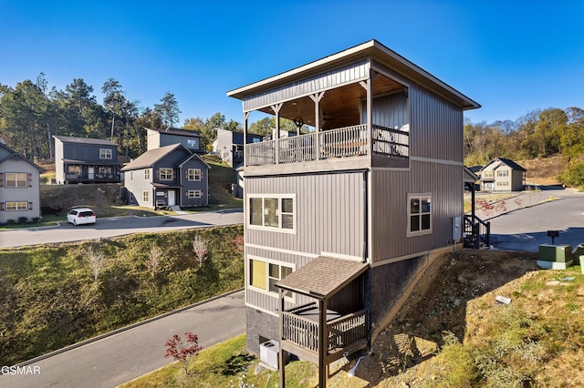 view of property exterior with a balcony