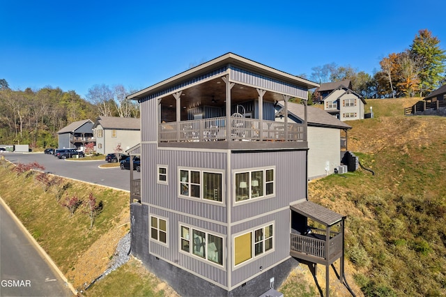 view of side of home with a balcony