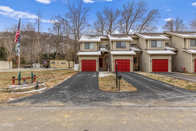 townhome / multi-family property with a garage