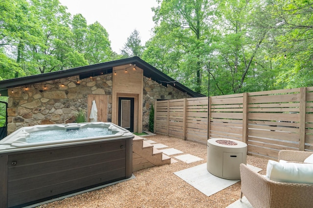 1008 Glades Rd, Gatlinburg, TN 37738 - view of patio / terrace with a hot tub and fence