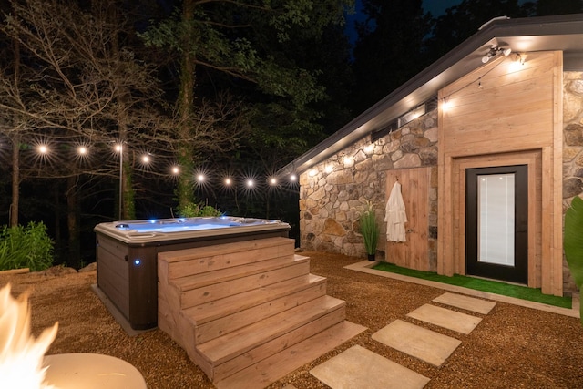 1008 Glades Rd, Gatlinburg, TN 37738 - exterior space with a hot tub and stone siding