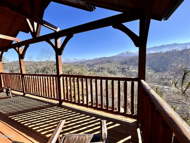 wooden deck featuring a mountain view