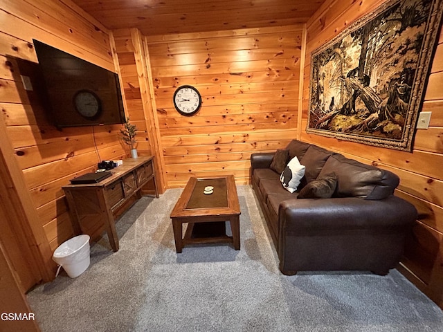 carpeted living room featuring wood walls and wooden ceiling