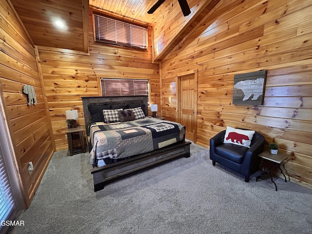 carpeted bedroom featuring ceiling fan, wood walls, wooden ceiling, and high vaulted ceiling