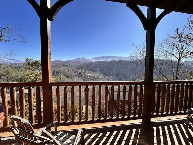 wooden terrace with a mountain view