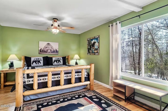 bedroom with wood-type flooring and ceiling fan