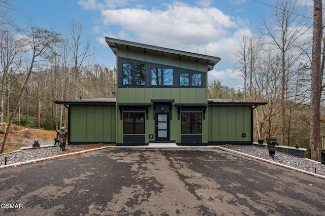 view of front of property featuring driveway and board and batten siding