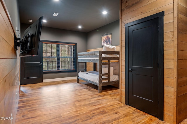 bedroom featuring visible vents, wood finished floors, and recessed lighting