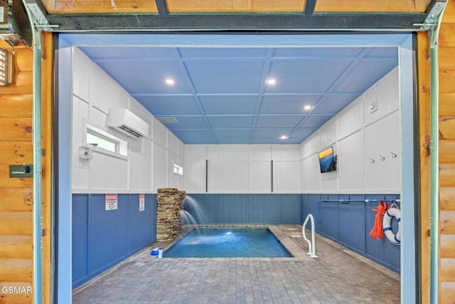 view of swimming pool featuring a wall mounted AC