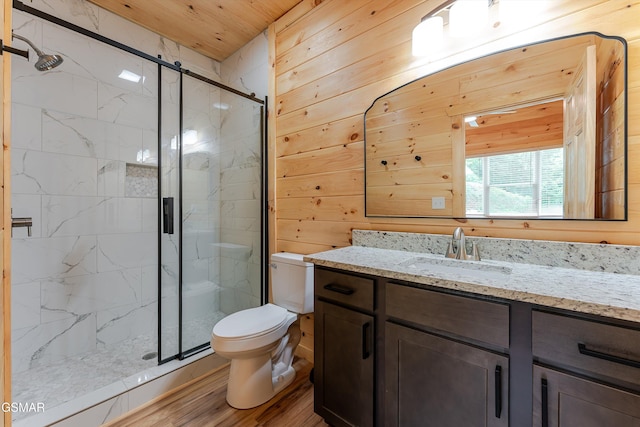 1012 Pinyon Cir, Pigeon Forge, TN 37863 - bathroom featuring a marble finish shower, vanity, wood finished floors, wooden walls, and wood ceiling