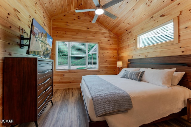 1012 Pinyon Cir, Pigeon Forge, TN 37863 - bedroom featuring wooden walls, wooden ceiling, multiple windows, vaulted ceiling, and wood finished floors