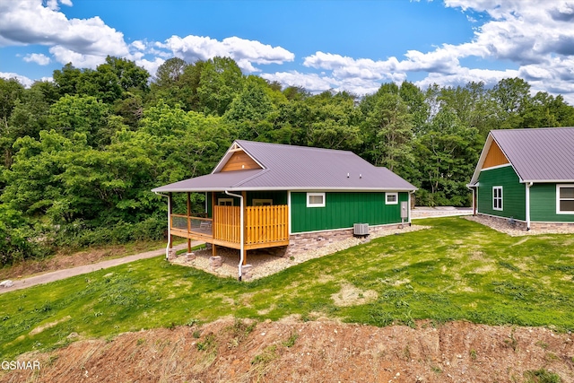 1012 Pinyon Cir, Pigeon Forge, TN 37863 - rear view of property featuring a wooden deck, a yard, and a metal roof