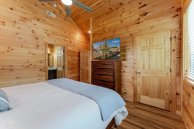 1012 Pinyon Cir, Pigeon Forge, TN 37863 - bedroom featuring lofted ceiling, wood walls, wood finished floors, wood ceiling, and a ceiling fan