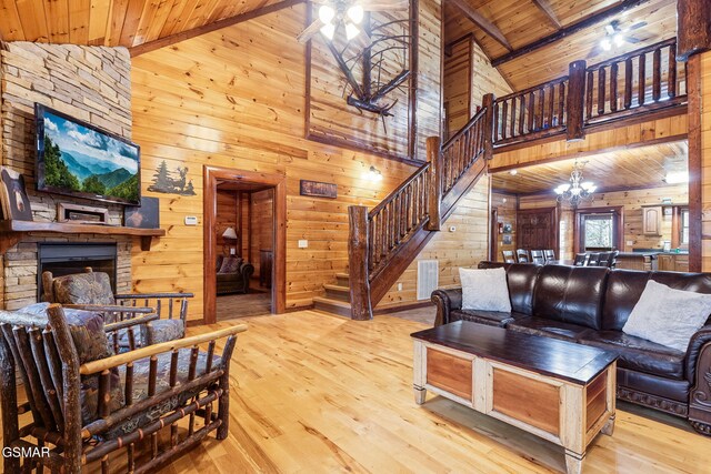 bedroom featuring wood-type flooring, wooden ceiling, wooden walls, and vaulted ceiling