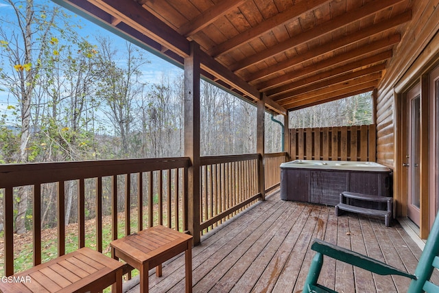 deck featuring a hot tub