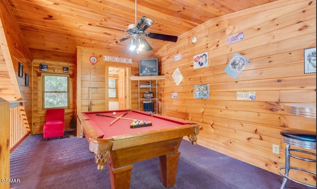 recreation room with wooden ceiling, lofted ceiling, wood walls, and dark colored carpet