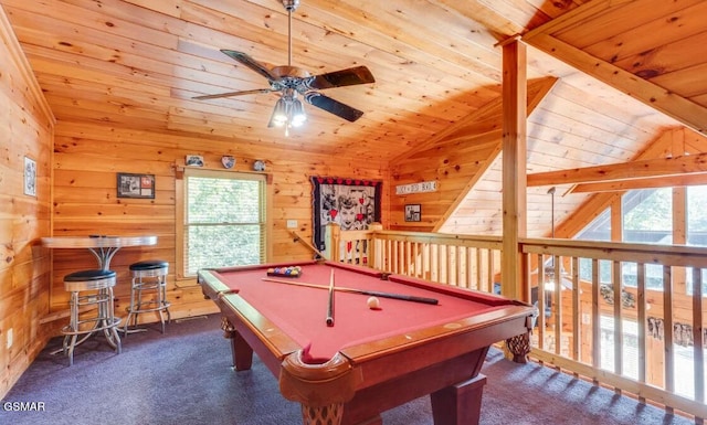 game room featuring ceiling fan, carpet flooring, wood ceiling, vaulted ceiling with beams, and wooden walls