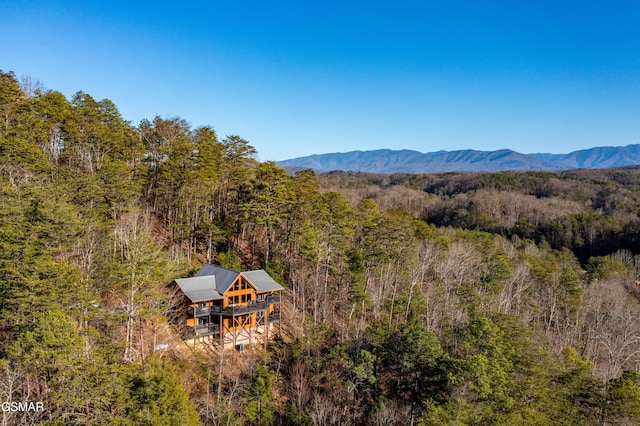 mountain view featuring a forest view