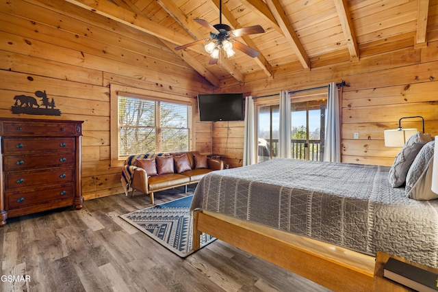 bedroom featuring multiple windows, wooden ceiling, and wooden walls