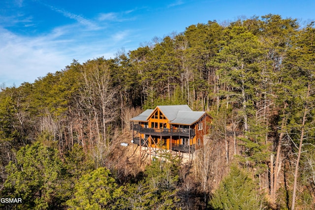 birds eye view of property with a wooded view