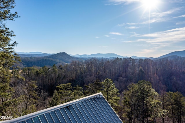 property view of mountains featuring a wooded view