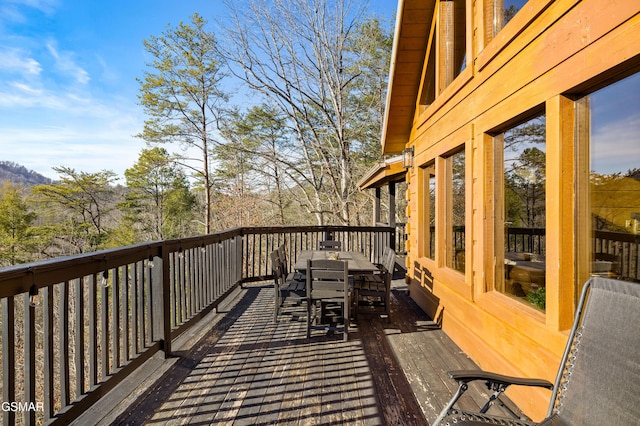 deck with outdoor dining area