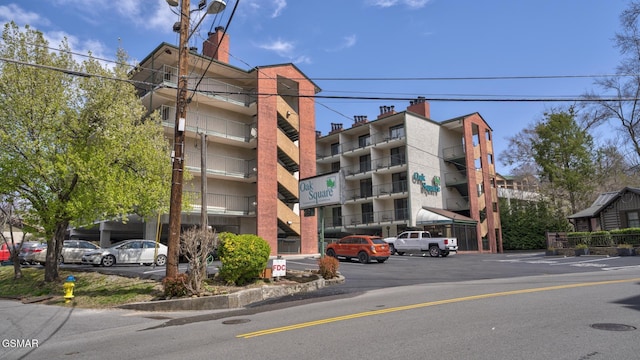 view of property featuring uncovered parking