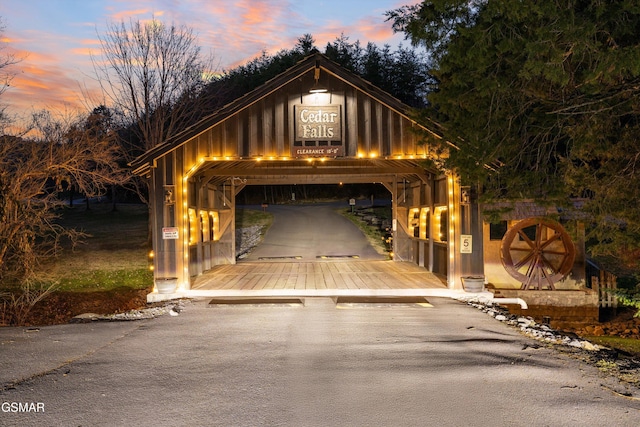 view of garage at dusk