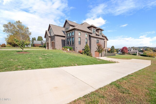 view of front facade with a garage and a front lawn