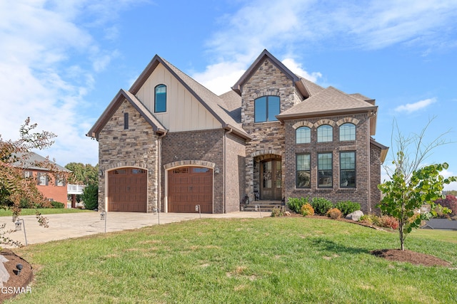 view of front of property featuring a garage and a front lawn