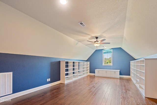 bonus room featuring hardwood / wood-style floors, ceiling fan, a textured ceiling, and vaulted ceiling