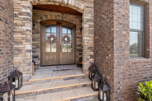 doorway to property featuring french doors