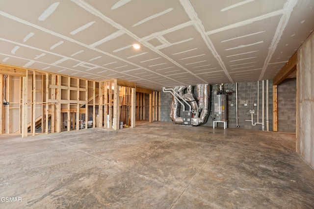 basement featuring gas water heater and heating unit