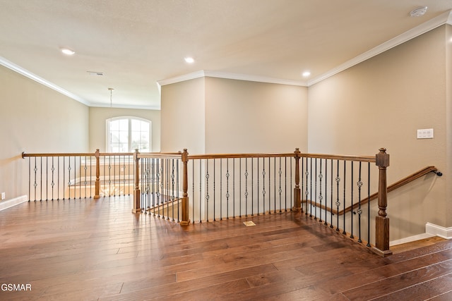 interior space featuring dark hardwood / wood-style floors and ornamental molding