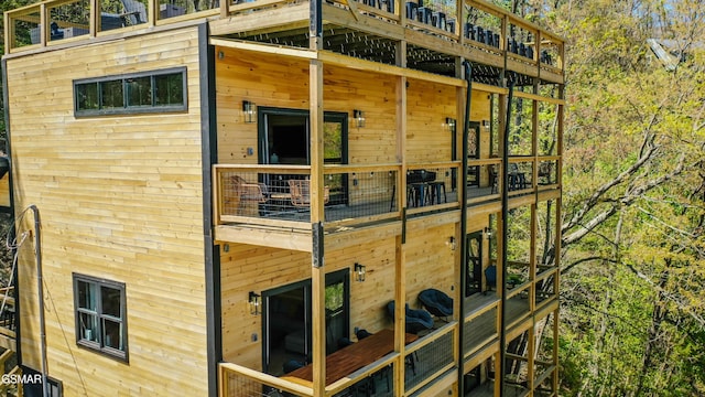 view of property exterior with a balcony