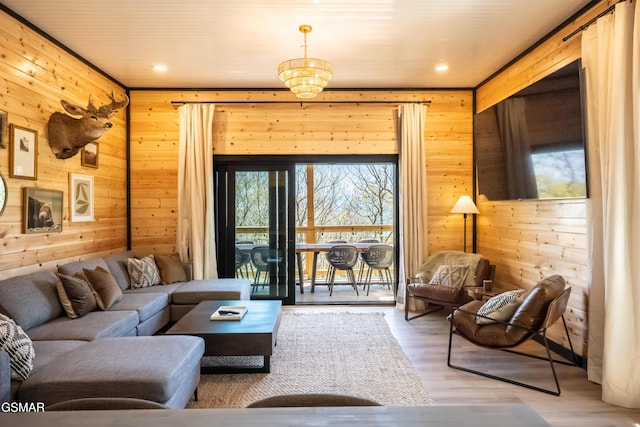 living room with wooden walls and wood finished floors