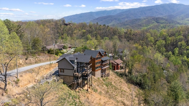aerial view with a view of trees and a mountain view