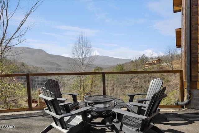 balcony featuring a fire pit and a mountain view