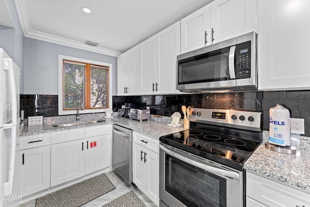 kitchen featuring stainless steel appliances, white cabinetry, and sink