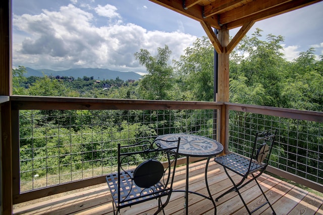 wooden terrace featuring a mountain view