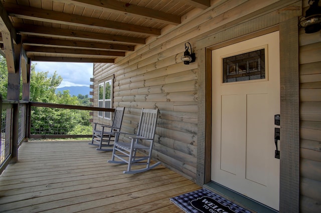 wooden deck featuring covered porch