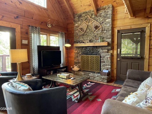 910 Laurel Lick Rd, Pigeon Forge, TN 37863 - living room with wood ceiling with exposed beams, healthy amount of natural light, wood finished floors, wooden walls, and a fireplace